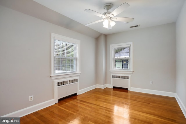 2739 Chesapeake St NW, Washington, DC 20008 - spare room with radiator heating unit, light wood finished floors, and healthy amount of natural light