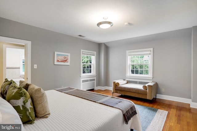 2739 Chesapeake St NW, Washington, DC 20008 - bedroom with multiple windows, wood finished floors, and baseboards