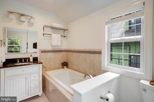 2739 Chesapeake St NW, Washington, DC 20008 - bathroom featuring a bath, plenty of natural light, toilet, vanity, and vaulted ceiling