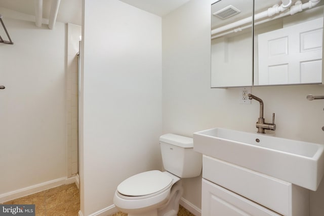 2739 Chesapeake St NW, Washington, DC 20008 - bathroom featuring toilet, a shower, vanity, and baseboards