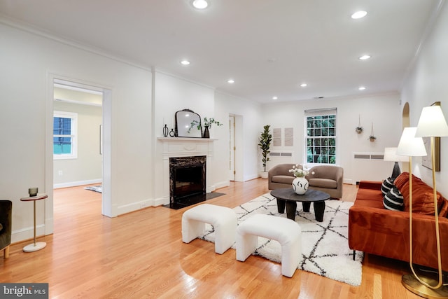 2739 Chesapeake St NW, Washington, DC 20008 - living area with crown molding, a high end fireplace, light wood-style floors, recessed lighting, and baseboards