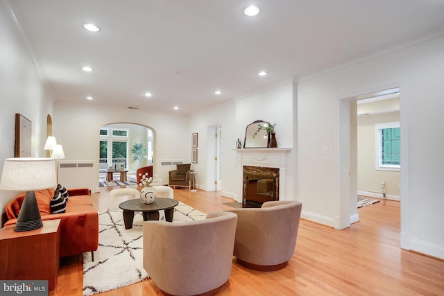 2739 Chesapeake St NW, Washington, DC 20008 - living room with arched walkways, crown molding, light wood-type flooring, recessed lighting, and plenty of natural light