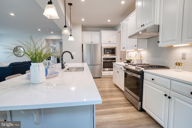 3163 Dodder Way, Odenton, MD 21113 - kitchen with stainless steel appliances, under cabinet range hood, a sink, backsplash, and white cabinetry