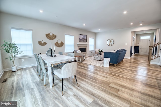 3163 Dodder Way, Odenton, MD 21113 - dining area with recessed lighting, a fireplace, light wood-style floors, stairs, and baseboards
