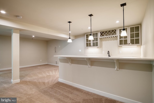 3163 Dodder Way, Odenton, MD 21113 - kitchen featuring light carpet, baseboards, a breakfast bar, recessed lighting, and light countertops