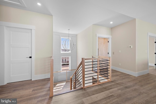 31 Phyllis Ln, Manahawkin, NJ 08050 - hallway featuring an upstairs landing, wood finished floors, baseboards, a chandelier, and recessed lighting