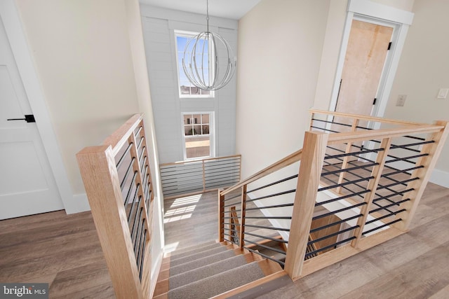 31 Phyllis Ln, Manahawkin, NJ 08050 - stairway featuring wood finished floors and a chandelier
