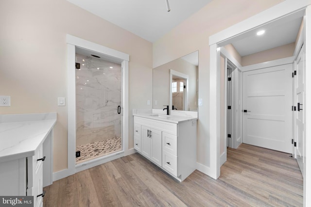 31 Phyllis Ln, Manahawkin, NJ 08050 - full bath featuring a marble finish shower, wood finished floors, baseboards, vanity, and recessed lighting