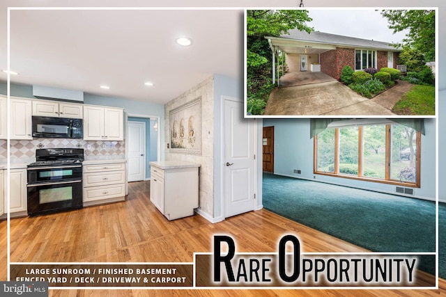 611 N Ct, Linthicum Heights, MD 21090 - kitchen with black appliances, white cabinetry, light wood-type flooring, tasteful backsplash, and light countertops