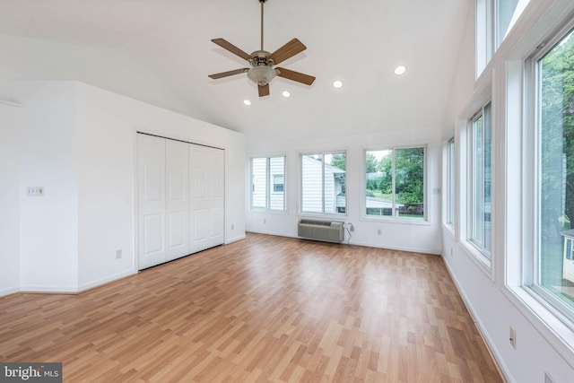 611 N Ct, Linthicum Heights, MD 21090 - unfurnished bedroom featuring multiple windows, a wall mounted air conditioner, recessed lighting, baseboards, and high vaulted ceiling