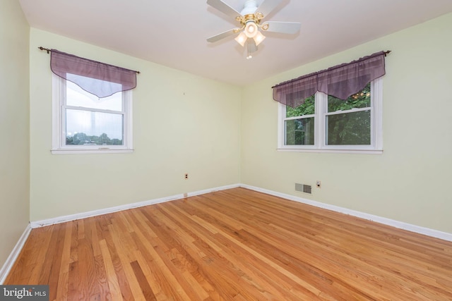 611 N Ct, Linthicum Heights, MD 21090 - spare room featuring plenty of natural light, light wood-style flooring, and baseboards