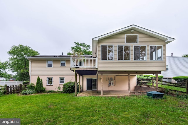 611 N Ct, Linthicum Heights, MD 21090 - rear view of house with a patio, roof mounted solar panels, and stucco siding