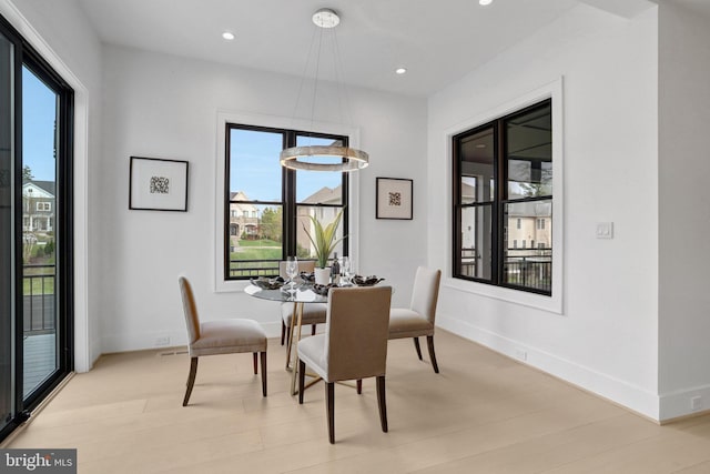dining area featuring healthy amount of natural light, recessed lighting, and baseboards