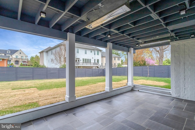 unfurnished sunroom with a residential view