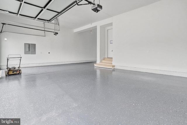 garage featuring a garage door opener and electric panel