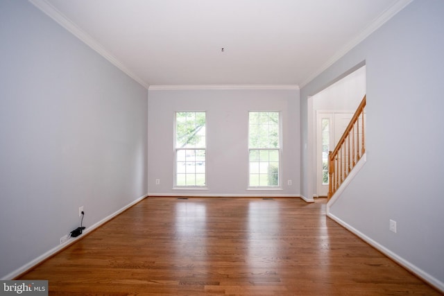 13076 Dove Tree Ct, Manassas, VA 20112 - empty room featuring wood finished floors, ornamental molding, stairs, and baseboards