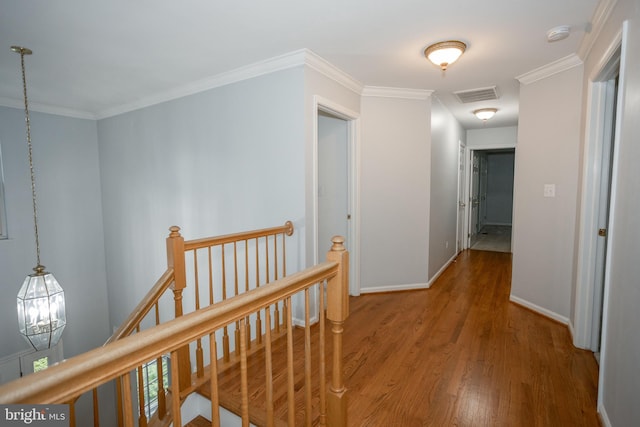 13076 Dove Tree Ct, Manassas, VA 20112 - hallway with an upstairs landing, wood finished floors, baseboards, and ornamental molding
