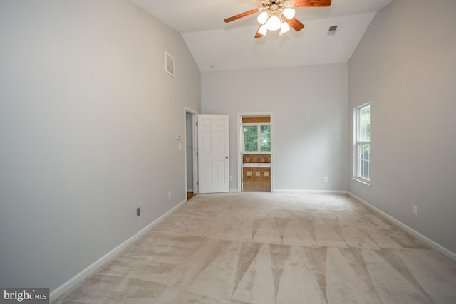 13076 Dove Tree Ct, Manassas, VA 20112 - spare room featuring high vaulted ceiling, a ceiling fan, light carpet, and baseboards
