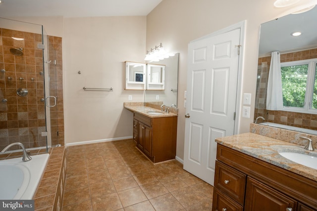 13076 Dove Tree Ct, Manassas, VA 20112 - full bath with a stall shower, a garden tub, baseboards, two vanities, and tile patterned flooring