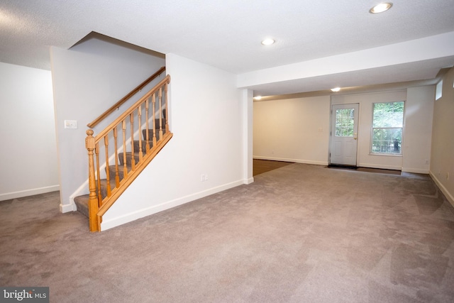 13076 Dove Tree Ct, Manassas, VA 20112 - basement featuring carpet, stairway, baseboards, and recessed lighting