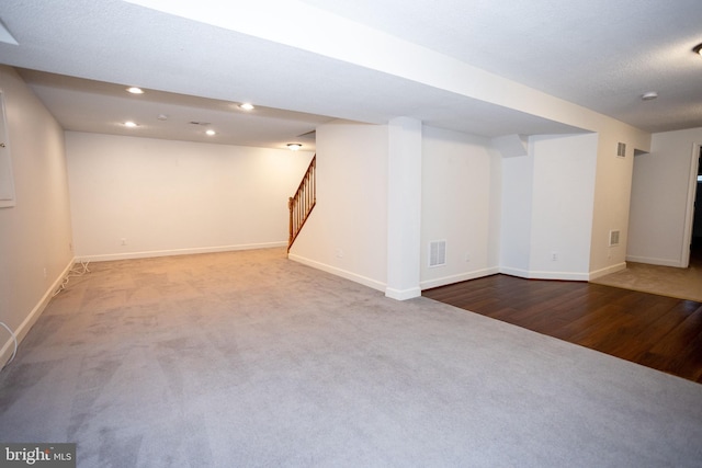 13076 Dove Tree Ct, Manassas, VA 20112 - finished below grade area featuring carpet floors, stairway, baseboards, wood finished floors, and recessed lighting