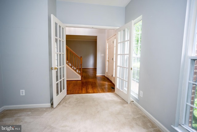 13076 Dove Tree Ct, Manassas, VA 20112 - foyer entrance featuring french doors, stairs, carpet floors, and baseboards