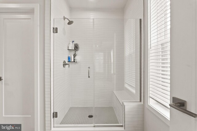 full bathroom featuring a shower stall