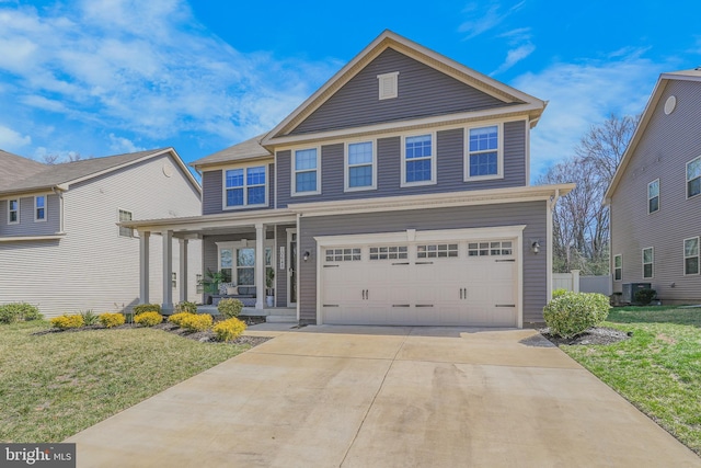 10648 Cheryl Turn, Waldorf, MD 20603 - view of front of property with covered porch, a garage, a front lawn, and driveway