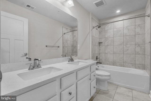 10648 Cheryl Turn, Waldorf, MD 20603 - full bathroom featuring toilet, tile patterned flooring, shower / tub combination, double vanity, and recessed lighting