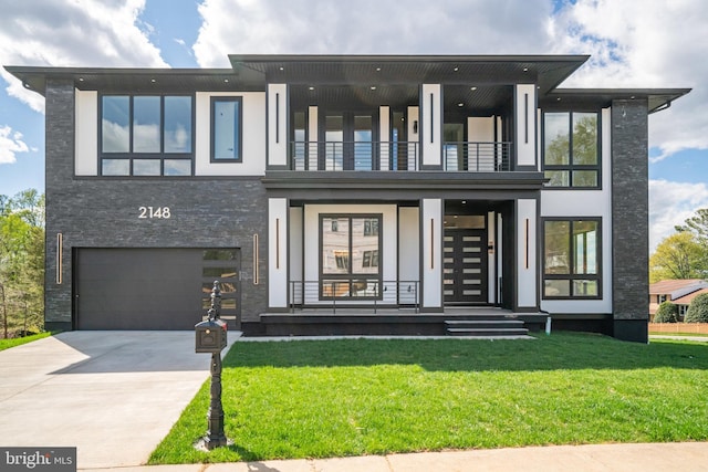 modern home with a balcony, an attached garage, a front lawn, concrete driveway, and a porch
