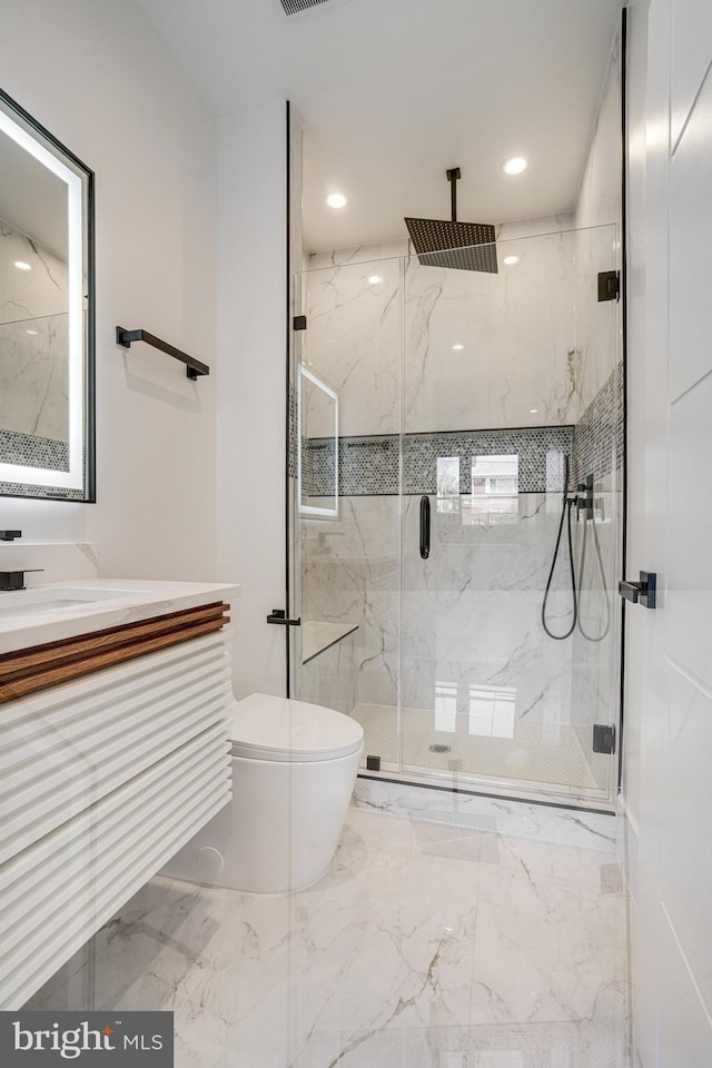 bathroom featuring toilet, a marble finish shower, marble finish flooring, vanity, and recessed lighting