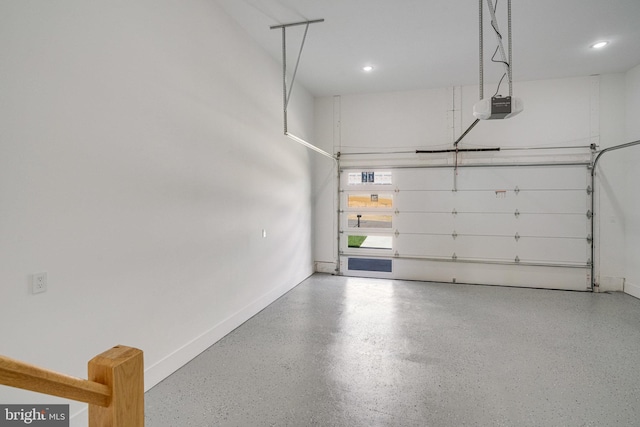 garage featuring a garage door opener, recessed lighting, and baseboards