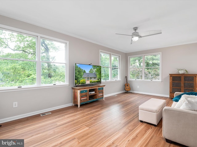 1018 Plum Creek Dr, Crownsville, MD 21032 - sitting room featuring ceiling fan, baseboards, ornamental molding, and light wood-style flooring