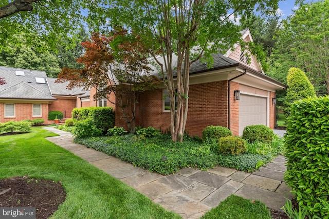2 Fieldspring Ct, Lutherville Timonium, MD 21093 - view of home's exterior featuring brick siding, a garage, and a yard