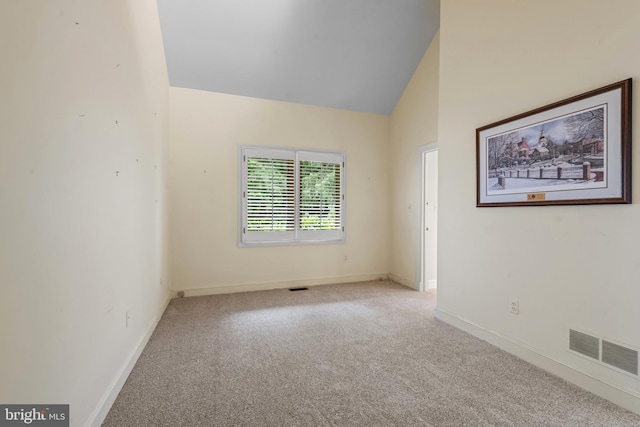 2 Fieldspring Ct, Lutherville Timonium, MD 21093 - empty room featuring carpet, vaulted ceiling, and baseboards