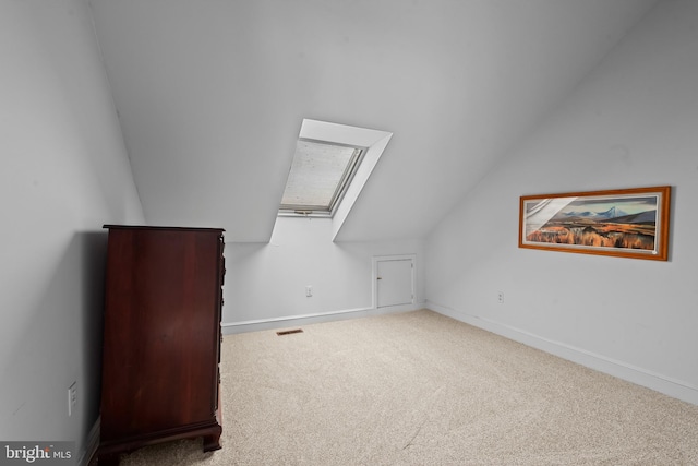 2 Fieldspring Ct, Lutherville Timonium, MD 21093 - additional living space with vaulted ceiling, carpet floors, a skylight, and baseboards