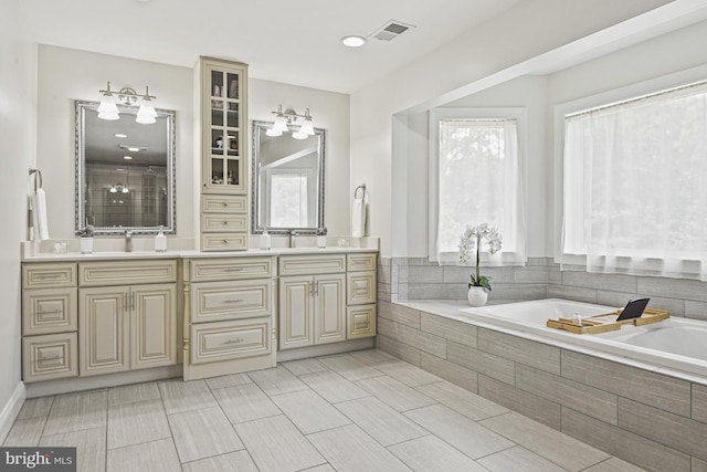 1016 Bellview Rd, Mclean, VA 22102 - full bathroom with double vanity, a garden tub, and tiled shower