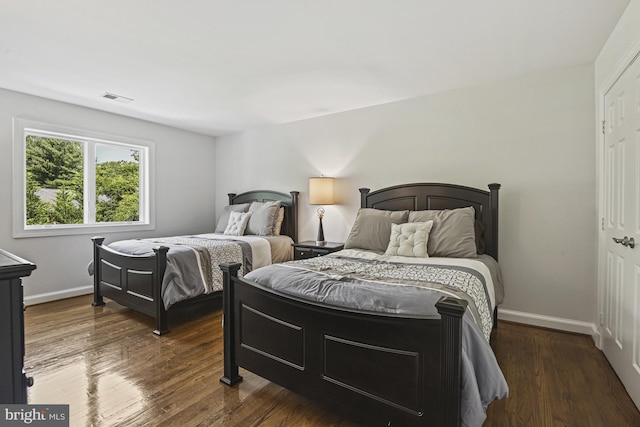 1016 Bellview Rd, Mclean, VA 22102 - bedroom with dark wood-style flooring and a closet
