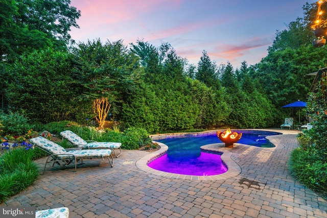 1016 Bellview Rd, Mclean, VA 22102 - pool at dusk featuring a patio area and an outdoor pool
