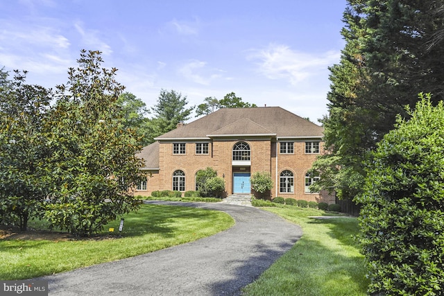 1016 Bellview Rd, Mclean, VA 22102 - georgian-style home with brick siding, a front lawn, and asphalt driveway