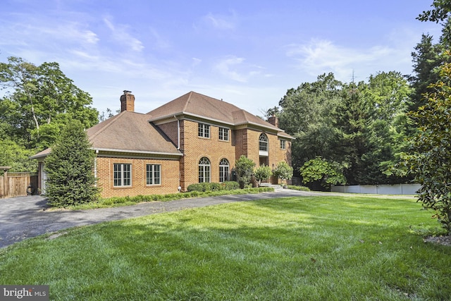 1016 Bellview Rd, Mclean, VA 22102 - colonial house featuring a chimney and brick siding