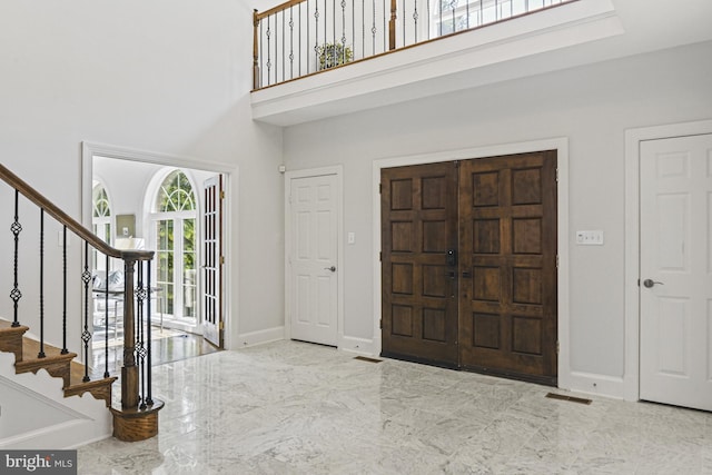 1016 Bellview Rd, Mclean, VA 22102 - foyer featuring marble tiled flooring, a high ceiling, and stairway