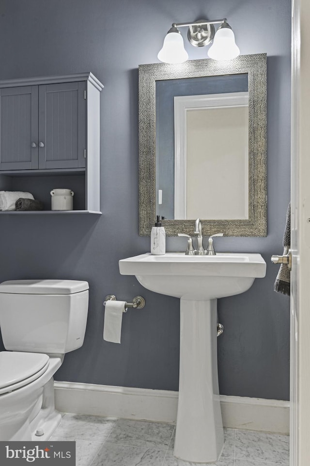 1016 Bellview Rd, Mclean, VA 22102 - half bath featuring baseboards and marble look tile flooring