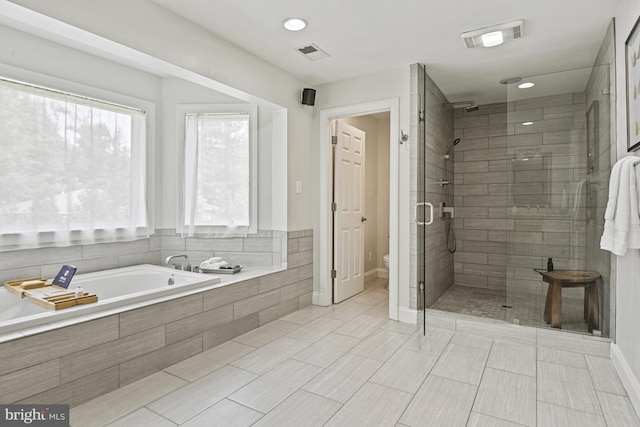1016 Bellview Rd, Mclean, VA 22102 - bathroom featuring a shower stall, a bath, and recessed lighting