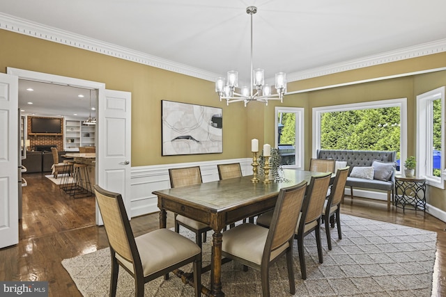 1016 Bellview Rd, Mclean, VA 22102 - dining area featuring a chandelier, crown molding, wood finished floors, a brick fireplace, and recessed lighting