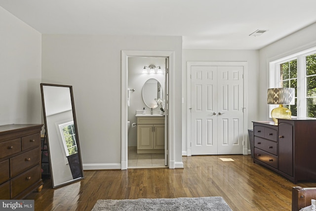 1016 Bellview Rd, Mclean, VA 22102 - bedroom with wood finished floors, a closet, and connected bathroom