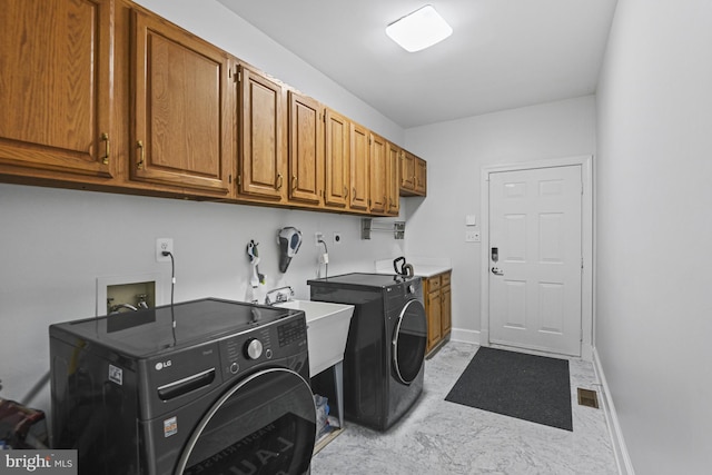 1016 Bellview Rd, Mclean, VA 22102 - washroom featuring cabinet space, independent washer and dryer, and light marble finish flooring