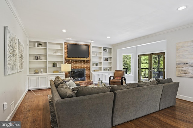 1016 Bellview Rd, Mclean, VA 22102 - living room featuring crown molding, a brick fireplace, wood finished floors, recessed lighting, and built in shelves