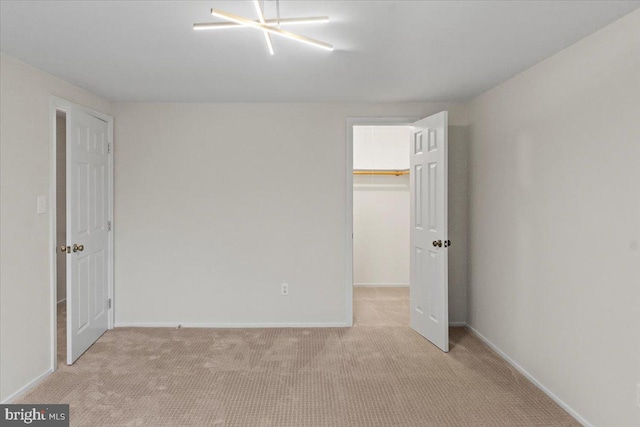 6867 Happyheart Ln, Columbia, MD 21045 - unfurnished bedroom featuring a spacious closet, carpet, baseboards, and a closet
