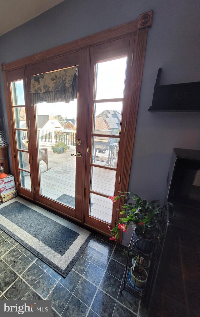 doorway to outside featuring healthy amount of natural light and french doors